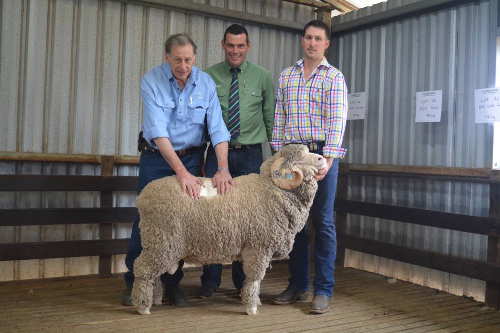 TASSIE BOUND: Pomanara's top-priced ram with stud principals Geoff Rayner (left) and his son, James (right), Sallys Flat, and Landmark auctioneer, Marcus Schembri.