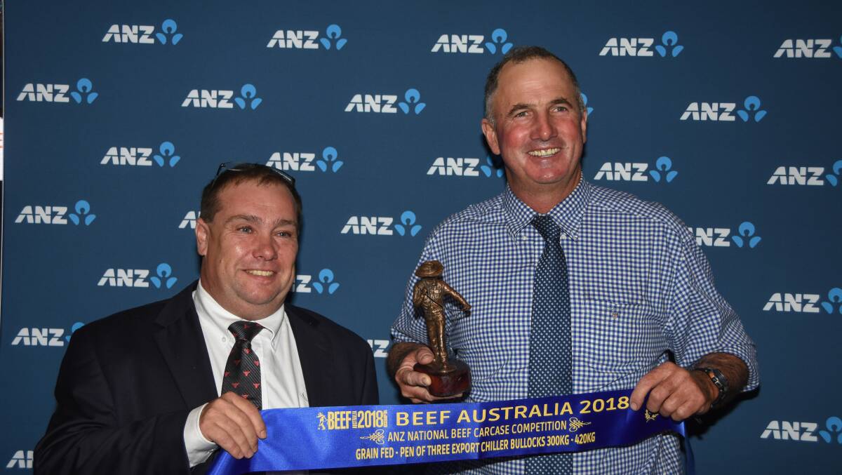 Mark Inglis, JBS Australia, congratulates Ben Mayne, Texas Angus, Warialda, on his family's class win in the ANZ National Carcase Competition at Beef 2018.      