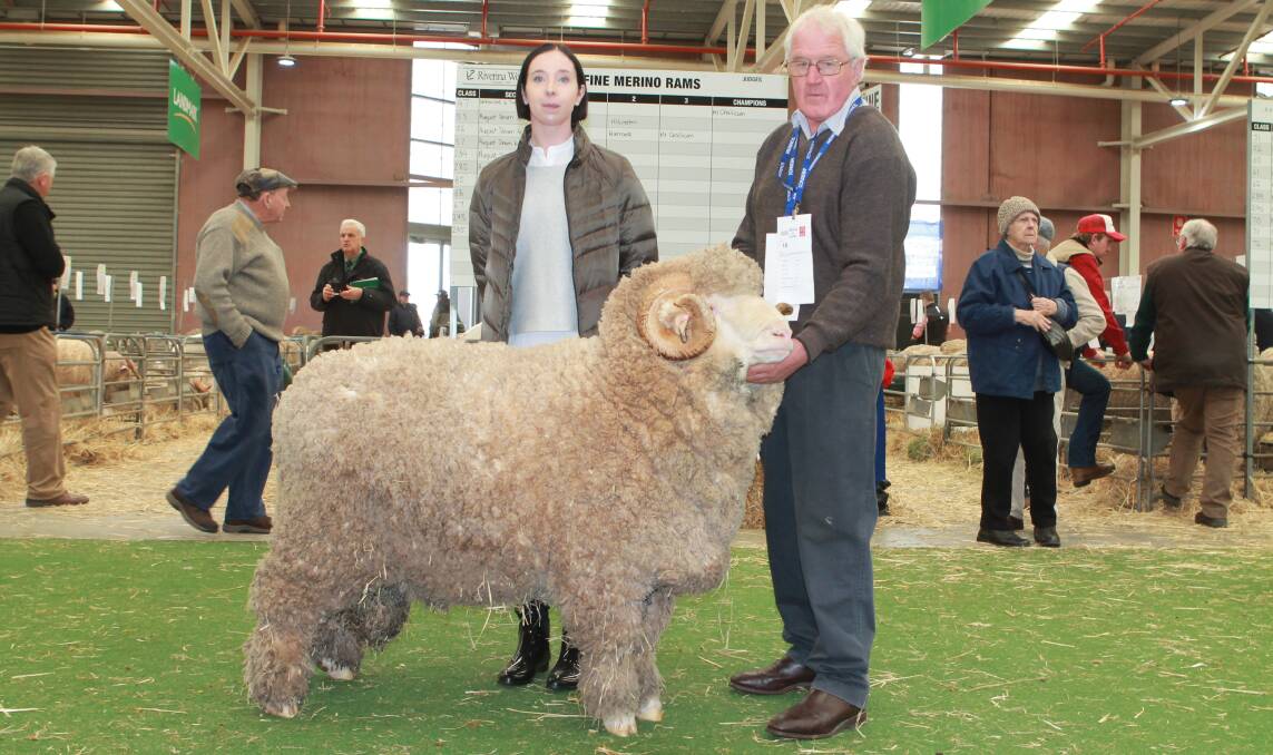 CHAMPION RAM: John Crawford with his daughter Nicole, Rock-Bank Merinos, Victoria Valley, and their grand champion ultrafine ram.