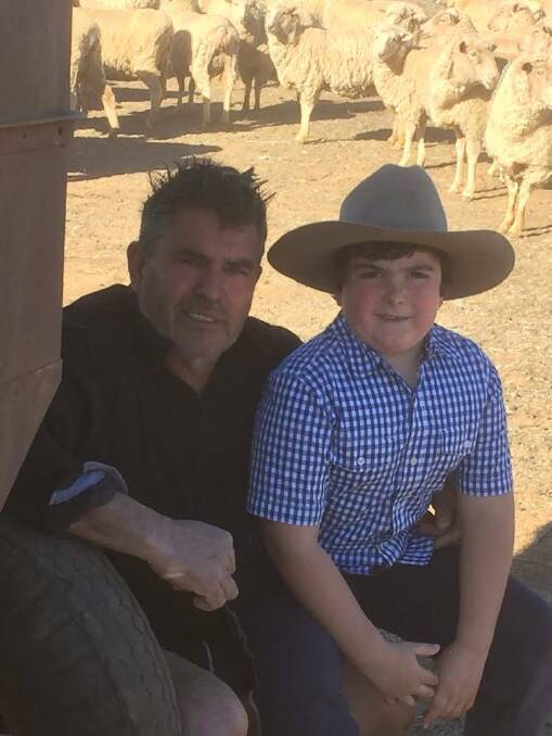 Brian Giddings with his son Fletcher. They have been supplementary feeding their stock since March 2017. 