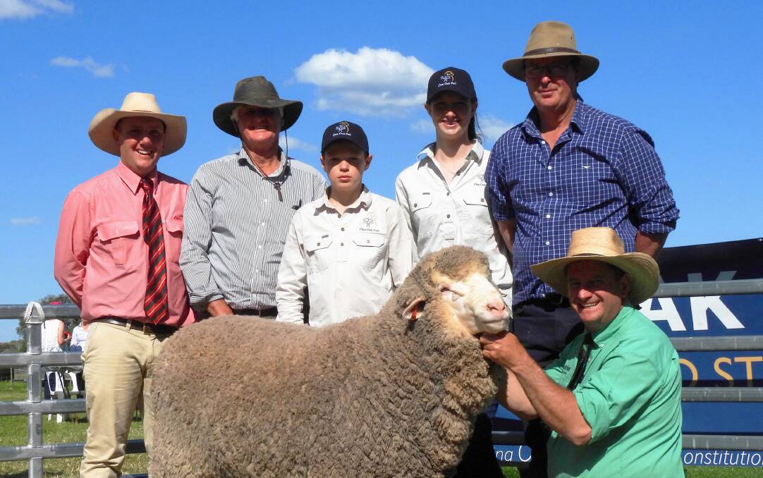 R19134 Red-31 with Nick Gray, Elders Jerilderie; Rodger Mathews, Borambil stud, Lachlan, Amelia and Alistair Wells with Rick Power Nutrien. Photo: Supplied
