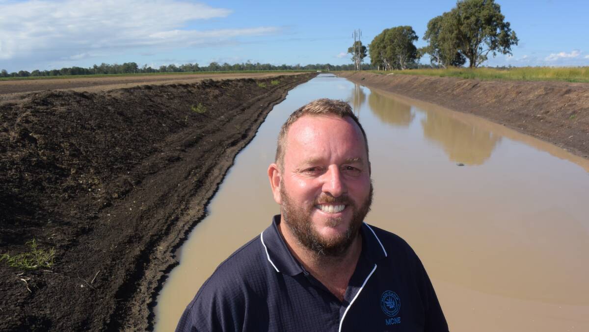 John Seccombe next to an irrigated water return channel, part of bold new tea tree plantation development at Greenridge via Casino. The future of Australian tea tree oil will rely on proving its purity to sensitive markets.
