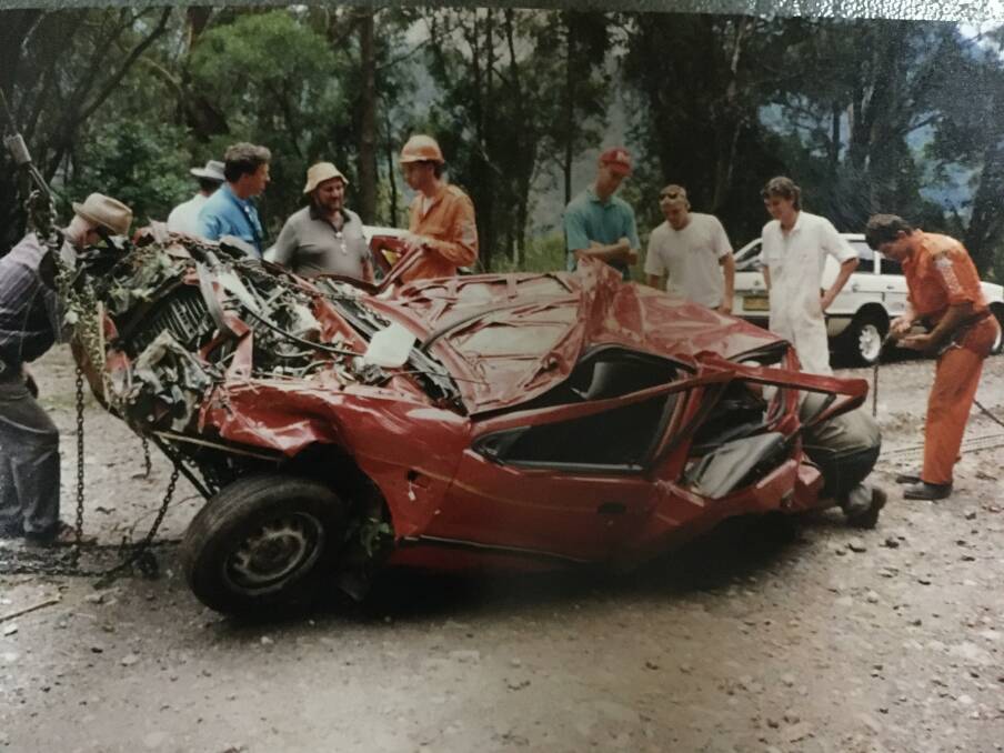 The Red Daihatsu Charade was pretty banged up after its epic fall.