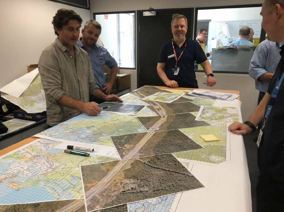 RFS, RMS and Pacific Complete staff worked together to plan the best way to manage fires either side of the Pacific Highway at New Italy. Photo by RFS.