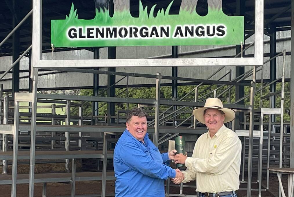 Nicholas Morgan, who started Glenmorgan Angus stud at Llangothlin in 2006, with deal-maker and Ray White agent Geoff Hayes, Glen Innes. Photo supplied.