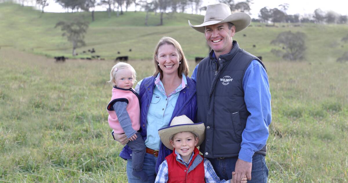 Wilmot manager Stuart Austin with Trisha Cowley and their children on paddocks that proved their resilience.