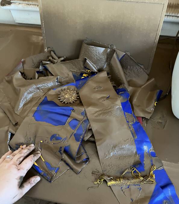Jenna Robinson's champion sash for Zone 1 young woman of the year discovered amongst mud and debris after record North Coast floods. After a good wash it "came up pretty good". Ms Robinson and her family headed to Sydney Royal Show this morning for some much needed distraction from the month of misery. Photo: Supplied
