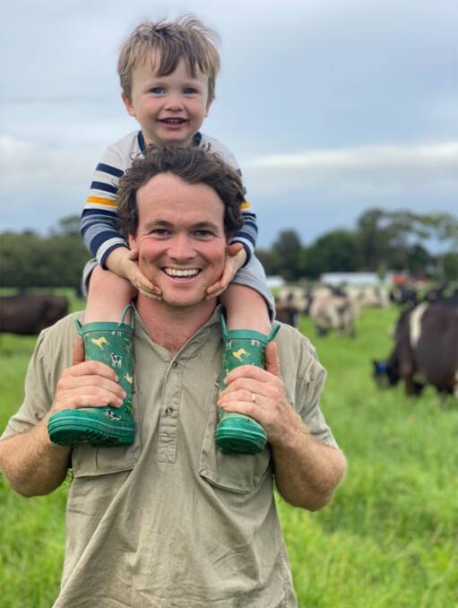Sam Nicholson with his son Albert who is positive about his dairy future after the devastating flood event in March. Photo: Rachel Nicholson