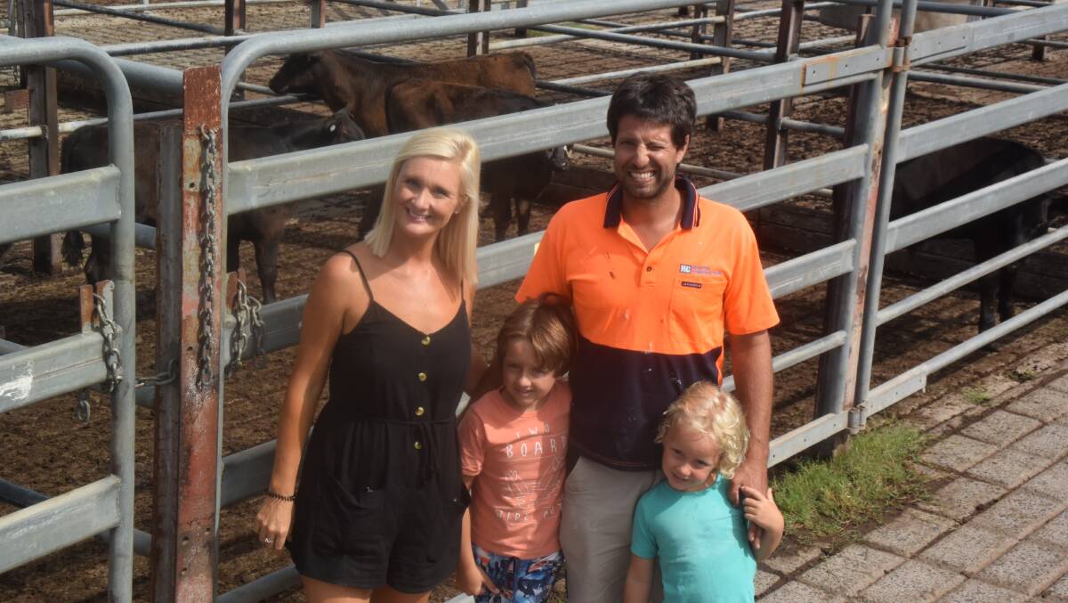 Tara and Luke Tweddle, Coffs Harbour, with their children Louie and Leo, bought a pen of Angus weaner heifers, already introduced to feed at a young age, 125kg for 170c/kg.