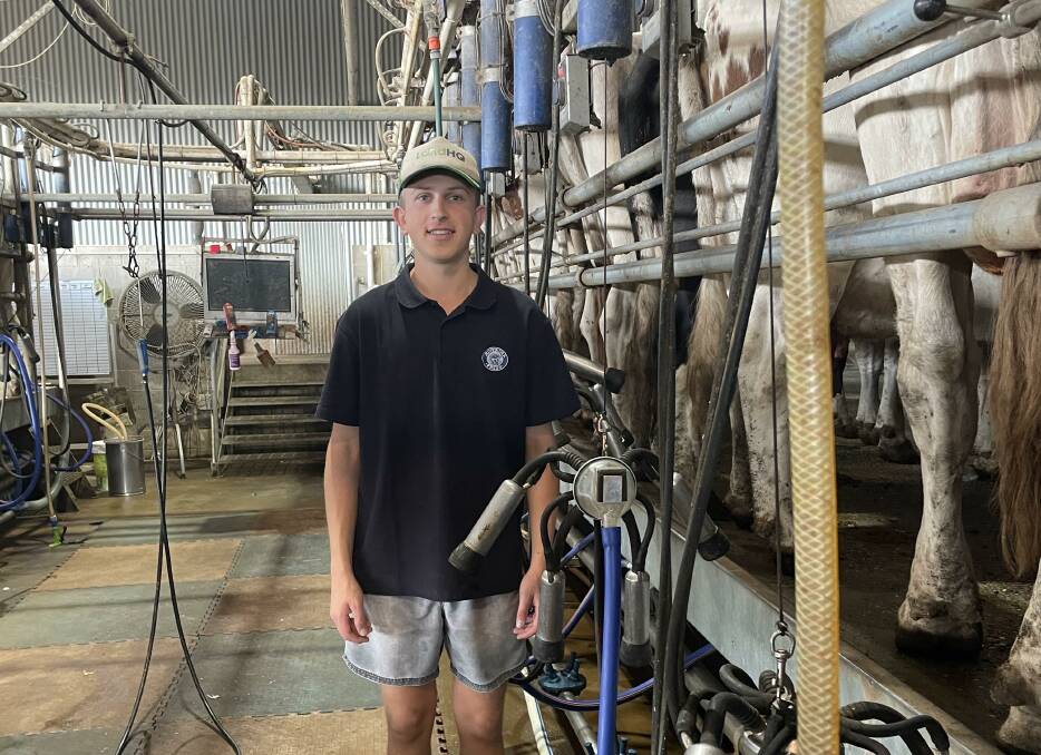 Macs Rubain in the dairy near Wagga Wagga where he works part time while attending class at university. Photo supplied.