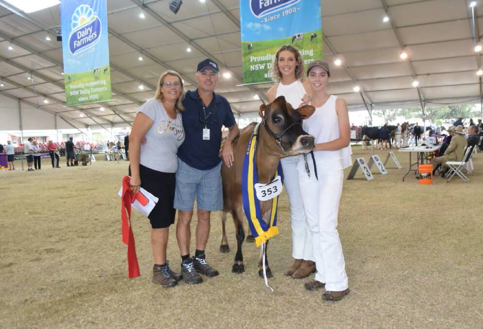 Mali Dillon, far right, with her reserve intermediate champion Jersey cow, Stormhill Madison Design, with her mother, Helen, father, Brad, and sister, Abby, in the show ring at Sydney Royal.