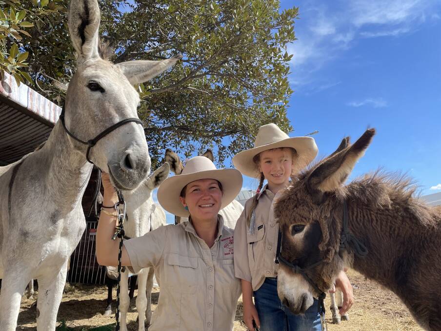 Emily and Abby Parrott, Oakfield Ranch, Birubi Beach with some of their donkeys. "It's about team work," she says. "You've got to read multiple animals at once."