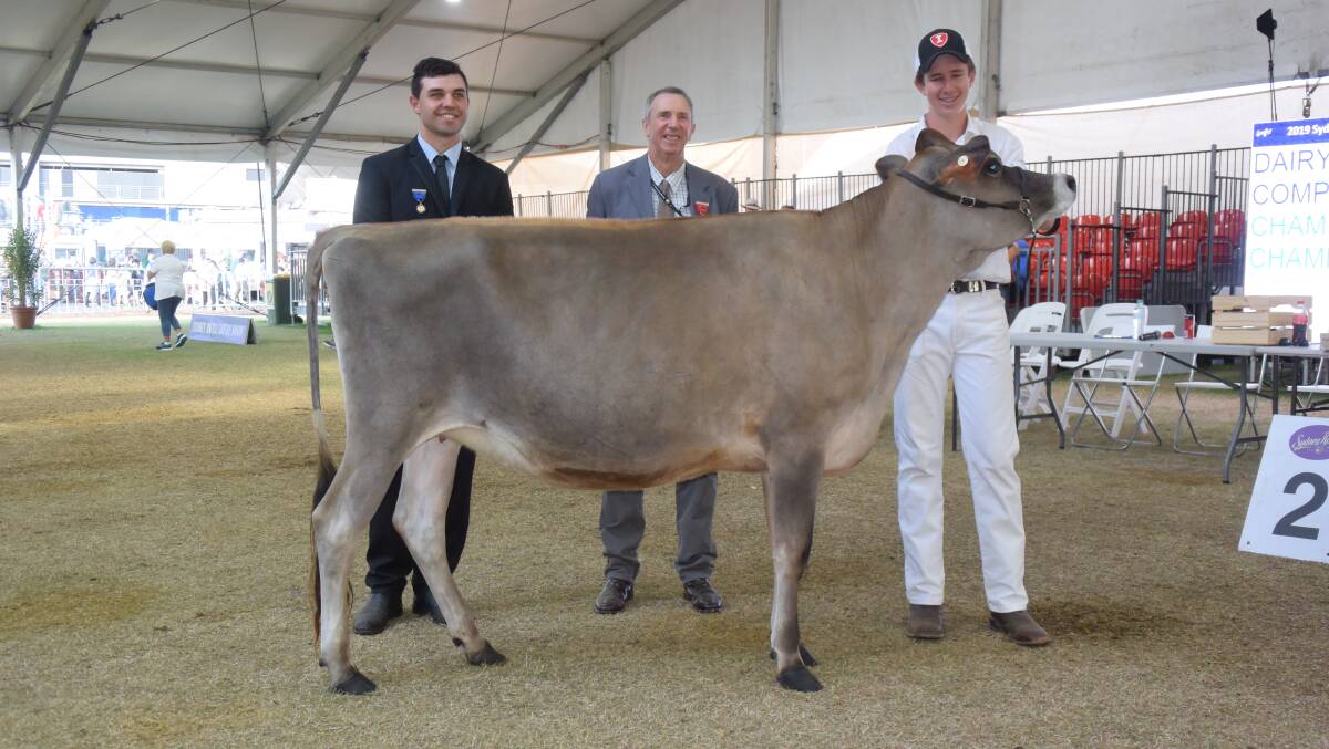 Dairy Paraders' judge Cameron Yarnold, Agricultural Societies Council of NSW director Michael Brennan, Jambaroo, and 2019 NSW representative for the dairy parading competition Mitchell Atkins, Tamworth, with the two year old Jersey heifer Shirlinn Joel Melys 2.