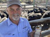 Chris Gunther, Glencoe, with a phone application designed to put profit first in the cattle trade. The software was developed within his family, based on generations of practical trial and error.