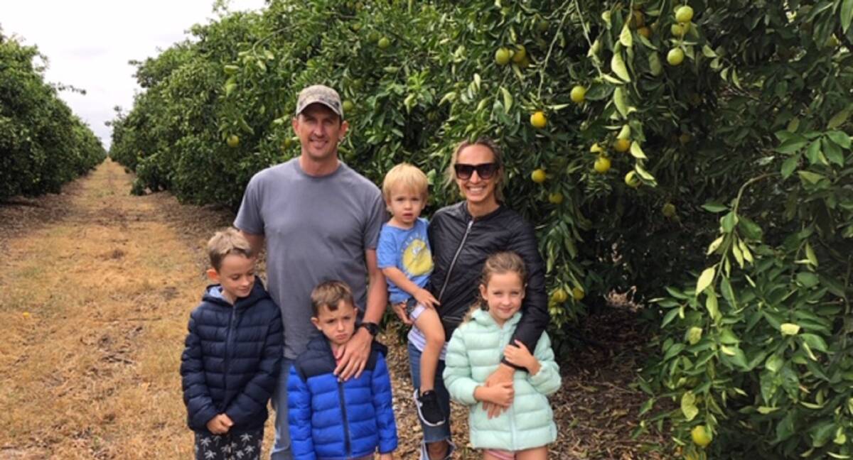 Archer Walters and his family at the Moree Valenica orchard owned by Grove Juice. "Figures show 75 per cent of Australians don't get their daily intake of fresh fruit and vegetables and orange juice is part of that."