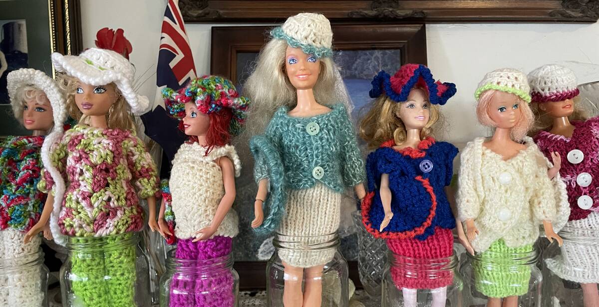 Barbie doll fashion, from balls of donated wool, help raise funds for cancer charity and keeps Elaine's fingers flying during evening television time.