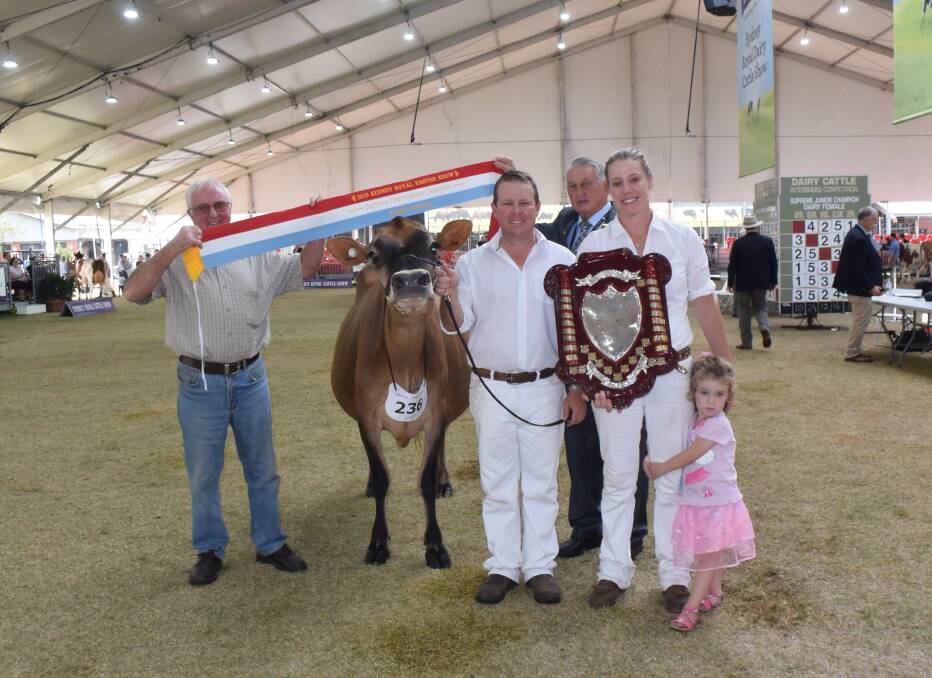 Supreme intermediate champion, Windy Ways Galaxies Dawn 7 exhibited in partnership by Brad, Jess and Penny Gavenlock, Berry, with breeder Frank Walsh of Windy Ways stud, Tongala, Victoria, pictured with former chair of the RAS Sydney Royal Show dairy section, Kevin Everett of Gloucester.