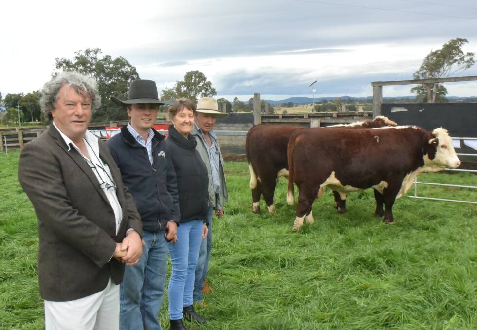 Franco Herefords stud principal Frank Hannigan with agent Riley Wellman, Jan and Jim Smith, Townview at Urbenville, with the top priced bulls - each making $14,000 on Friday at Casino.