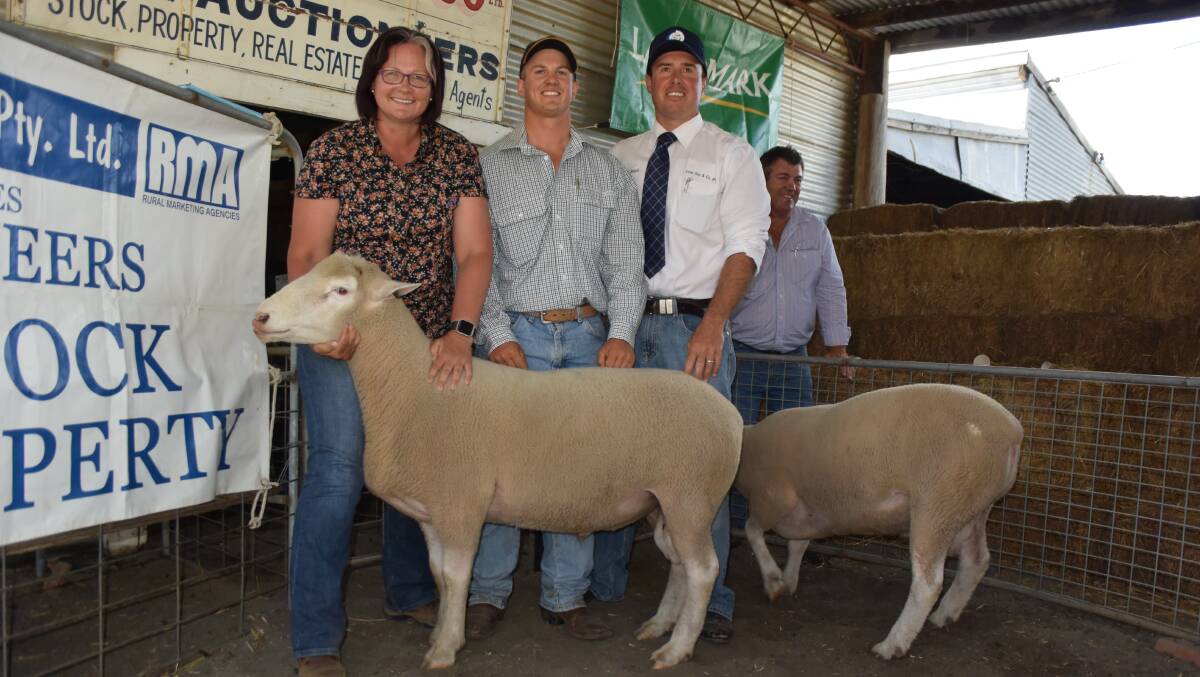 Jody Lamph, agricultural teacher at Glen Innes High School with lot 15, 111kg, by the prolific Yasloc 604/12 ram sold for $1600. They are pictured with Yasloc stud principal Nick Say, auctioneer Shad Bailey, Colin Say and Company, and stud principal Andrew Say.
