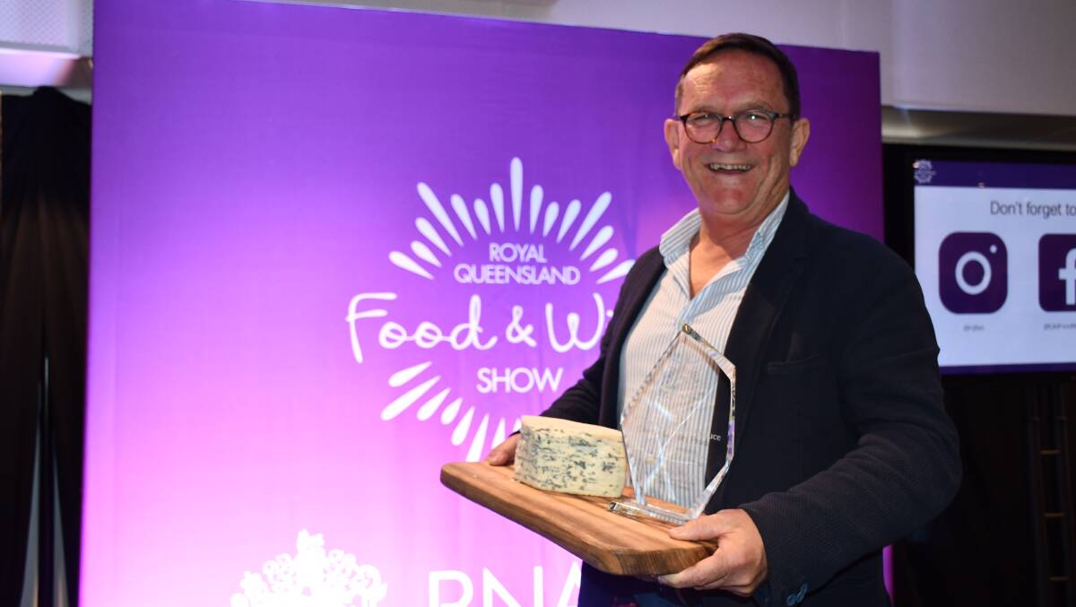 Peter Cross from Manassen Foods accepting the Grand Champion Dairy award on behalf of Berrys Creek Gourmet Cheese. 