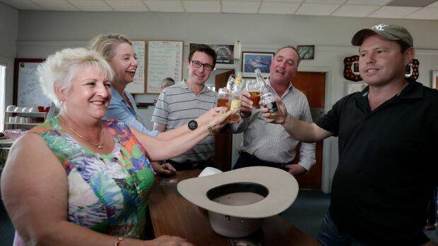 Mr Joyce has a beer while meeting with Nationals colleagues Michelle Landry, Bridget McKenzie, David Littleproud and Andrew Broad at the Aero Club at the Tamworth Airport on Friday. Photo: Alex Ellinghausen