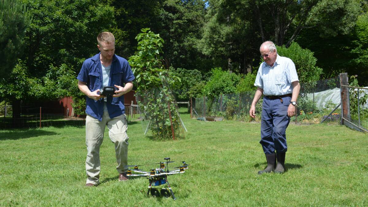 Toby Gow and George Manye testing the drone at Campanella Cottage, Mount Wilson