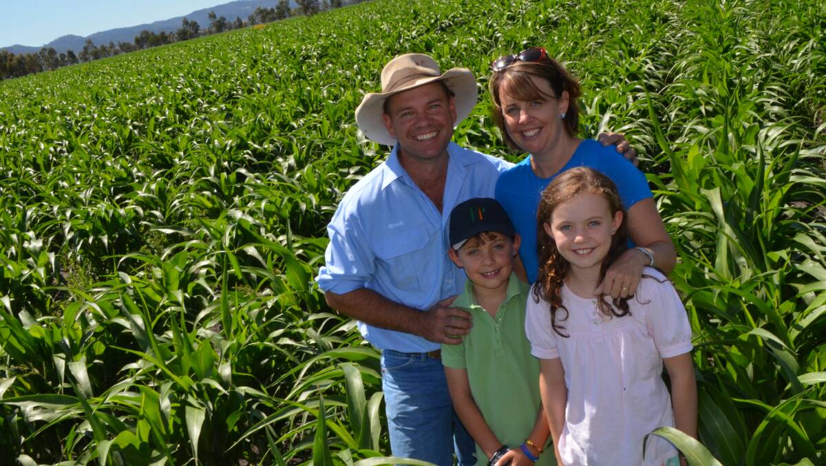 Bruce and Susan Nixon with their children Billy, 8, and Charli, 10, in the sorghum crop.