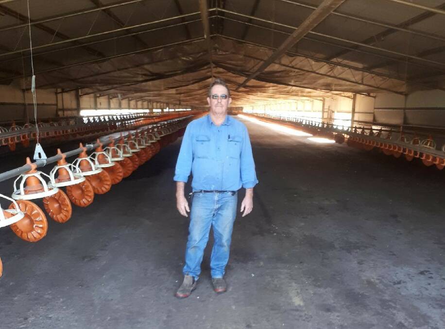 John Courtney, North Casino, stands in his empty chicken shed, having lost his processor contract earlier this year. Mr Courtney said he could lose millions on his chicken-specific infrastructure. Photo: Supplied