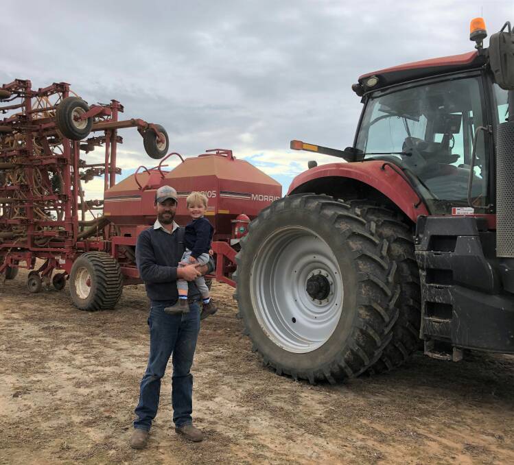 Michael Skipper with son Jack, 2, Bereni Pastoral Co, Billimari near Cowra. The Skippers had already reduced barley plantings after early rain. Photo supplied.