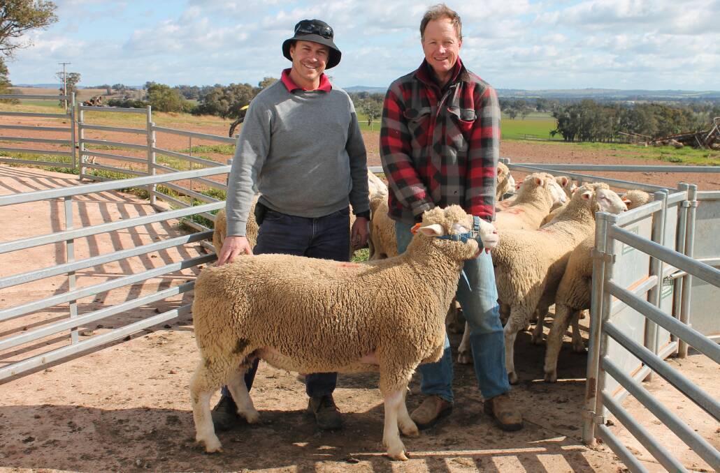 The top priced ram sold for $3300. Pictured with purchaser Michael Edwards, Goba Creek Station, Boorowa and Rowallan stud principal, Matt Reid. Photo supplied.
