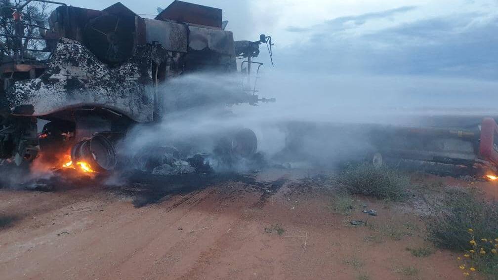 A header goes up in flames in the Mid-Lachlan District where there have been four headers totally destroyed already this harvest. Photo: RFS Mid-Lachlan Zone