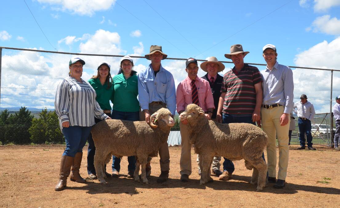 The two top-priced rams with purchaser Zoe Rolfe, Kenilworth Grazing, Nimmitabel, Greendale's Ivy, Miranda and Alan McGufficke, Elders' Sam Green and Tim Schofield and Greendale's Mark and Lachlan McGufficke. 