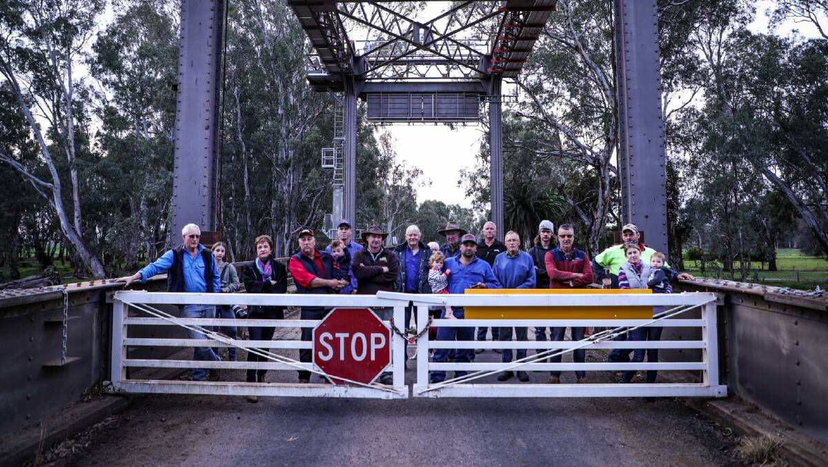 Residents gathered at the Gonn/Murrabit bridge yesterday afternoon to voice their concerns. The bridge has been locked due to the NSW/Victoria border closure. Photo supplied. 