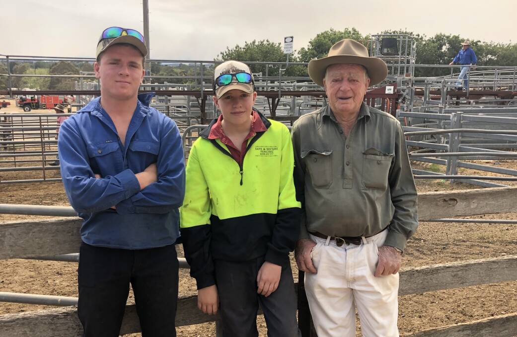 Jim Sturgiss of Braidwood said they were selling poddy calves as lack of feed meant they were unable to keep anything that wasn't producing. Pictured with grandsons, Jake and Harry Waters, Braidwood. 