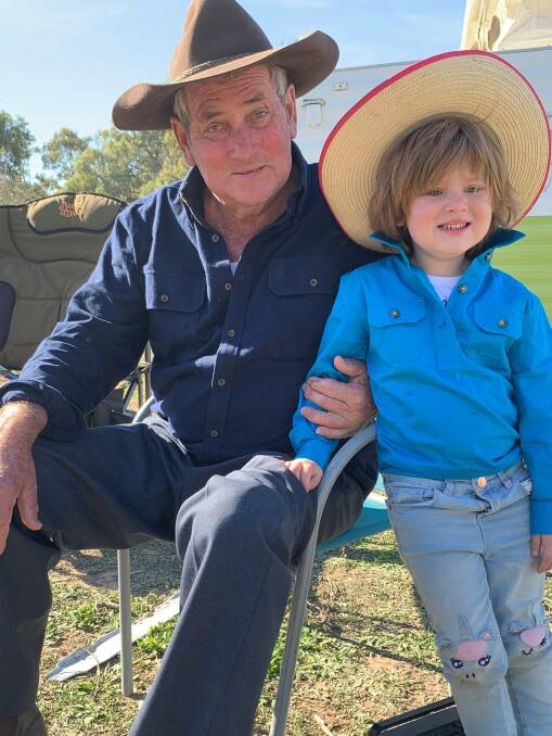 Kevin Kernaghan with his granddaughter Harper. Kevin has been droving for close to 65 years. Photo supplied.