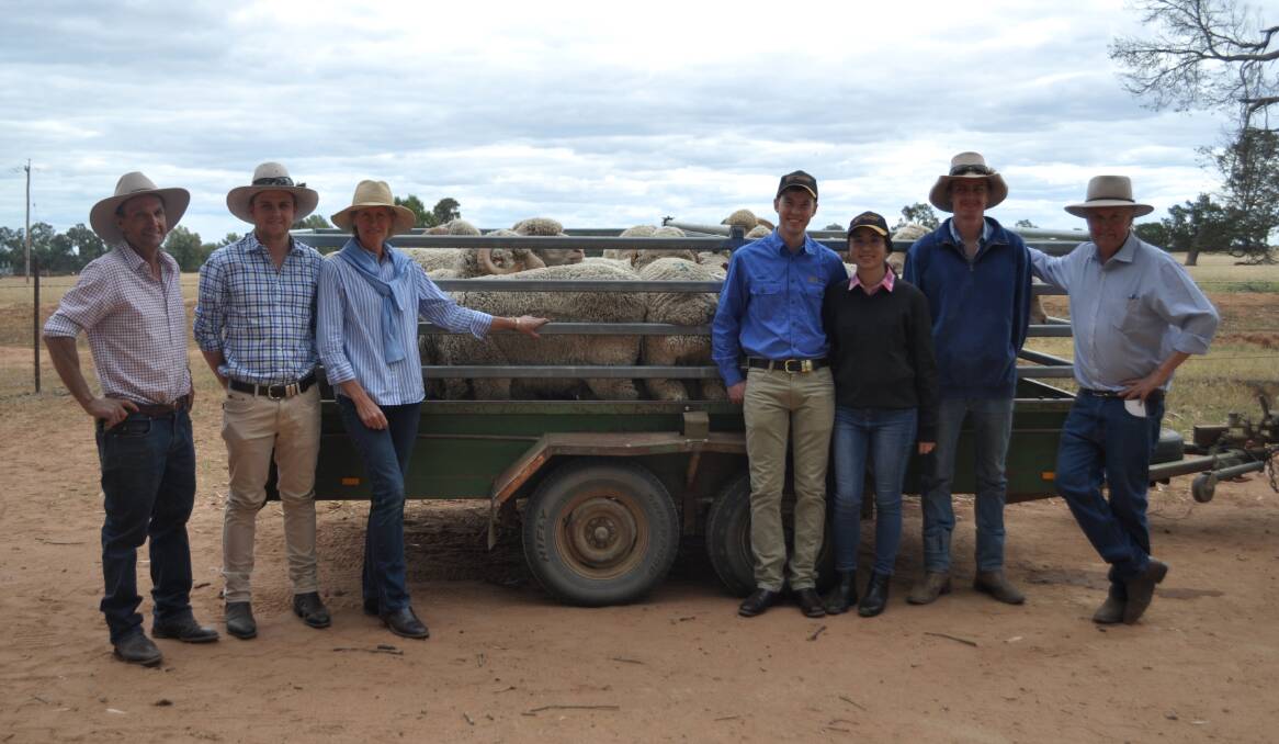 The Sleigh's from Jerilderie were a volume buyer of the day, taking home 14 rams for an average of $2700. Pictured, Andrew, Ian and Julie Sleigh, Angus and Heidy Heath, Jerilderie, Tom Sleigh and the Sleigh's wool classer, Chris Bowman.