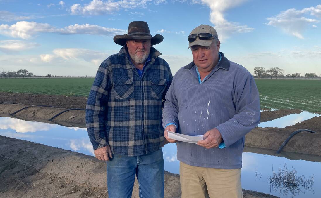 Bourke farmer John Gordon with his brother Andrew Gordon. A string of water policy decisions in the Barwon-Darling has meant the Gordons have been left with largely stranded water assets. Photo supplied by John Gordon. 