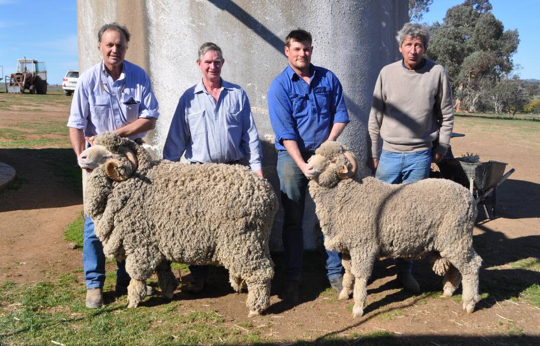 Two of the three top-priced rams alongside George Merriman, Merryville, Boorowa, purchaser Partick Davis, Demondrille, Boorowa, Jeremy Dreverman, Merryville and purchaser Frederic Mathieu, Checkers Pastoral Company, Cargo. 