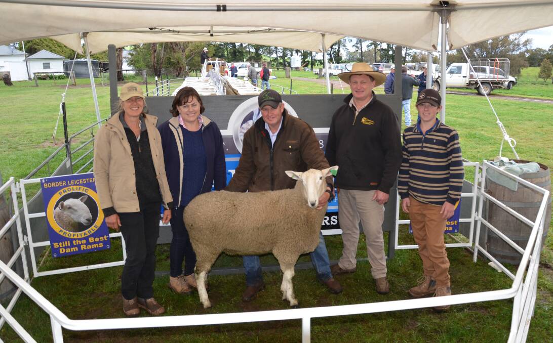 The top-priced ram with Kylie Anderson, Talkook, purchaser Tracy Buerckner, Bauer stud, Ariah Park, Scott Anderson, Talkook, auctioneer Greg Anderson and Lachlan Buerckner, Bauer stud, Ariah Park. 