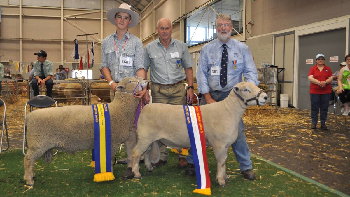 Reserve grand champion ram shown by Jake Webster, West-Ray, Bathurst with the grand champion ram shown by his grandfather, Ross Wilson, Cotties Run, Bathurst and judge Peter Shepherd, Wheeo, Crookwell. 