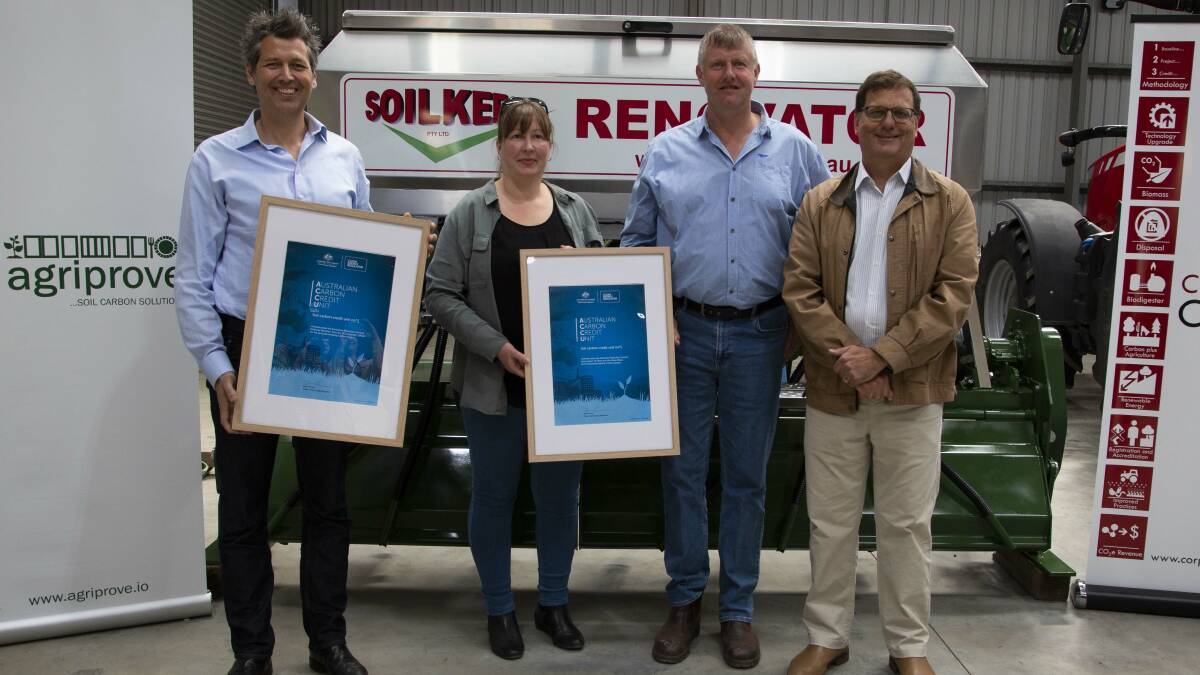 Soilkee's Niels and Marja Olsen and AgriProve's Matthew Warnken receiving their carbon credits. Photo supplied by the Department of the Environment and Energy.