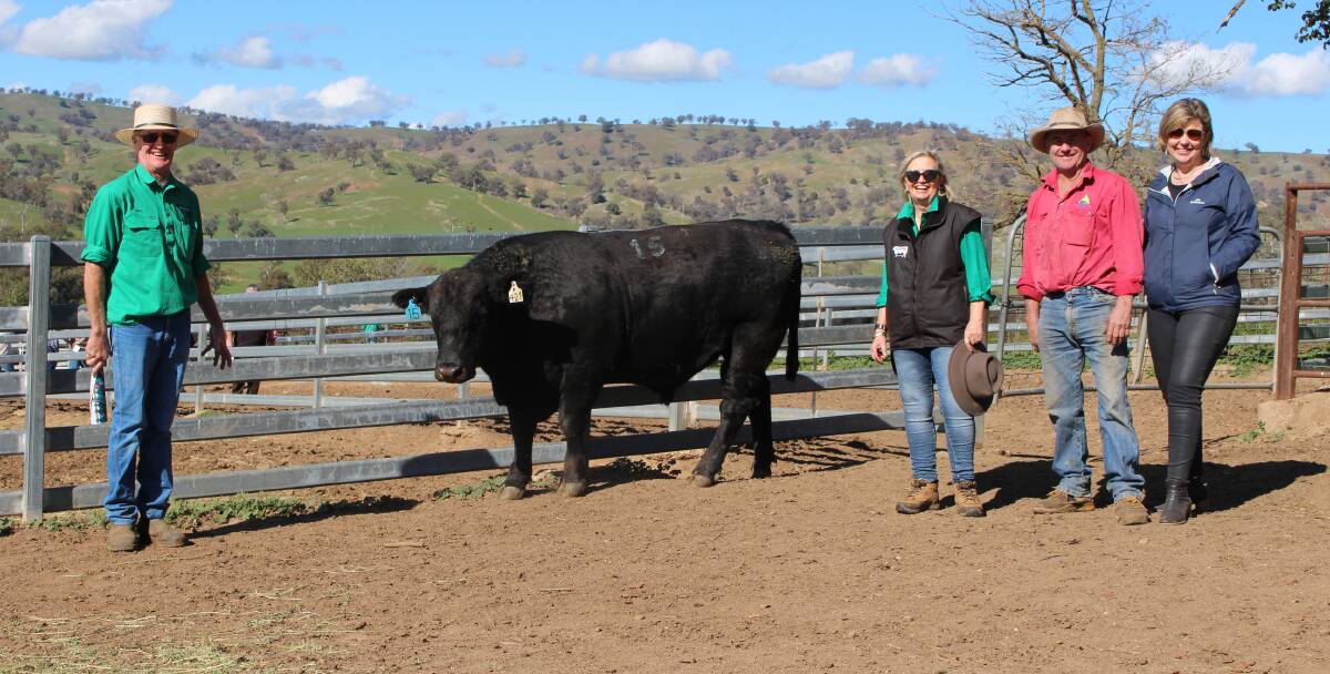 Bill and Shauna Graham, Bongongo Angus, Coolac with Paul and Rachel Graham, Coolac, purchasers of the top-priced bull, Bongongo P421. Photo supplied. 