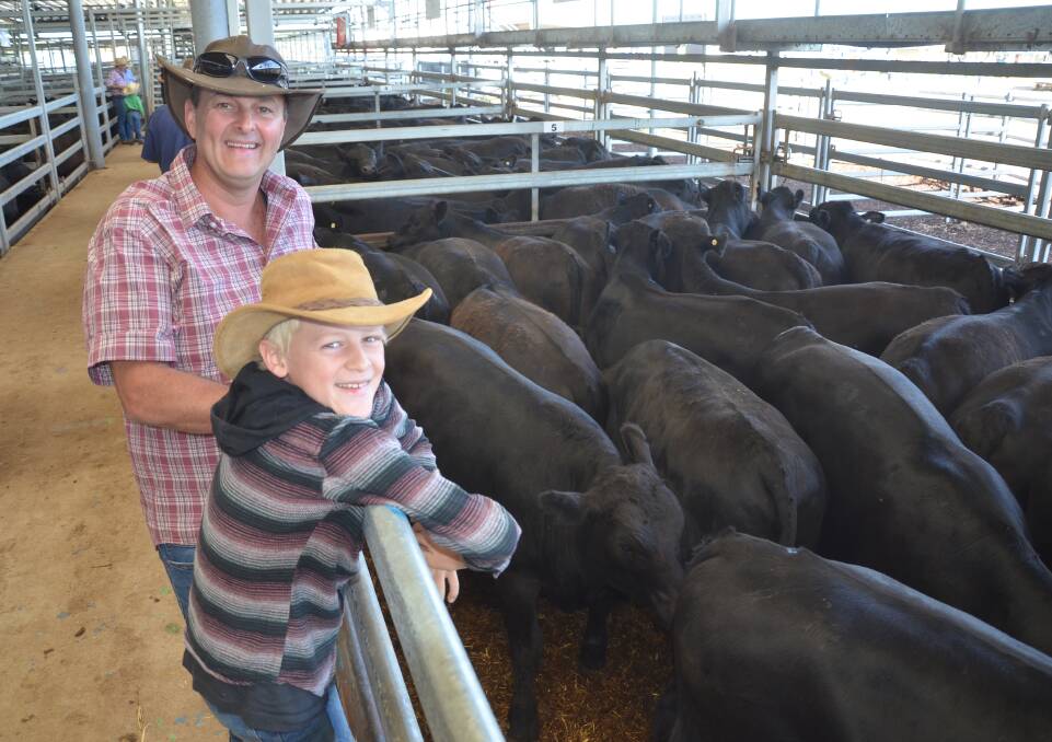 Peter Boyd, with his son Israel, 10, Bobinawarrah, Victoria, sold about 100 weaners at Tuesday's Wodonga weaner sale. Their steers topping at $1820 a head, while their heifers reached a high of $1530. 