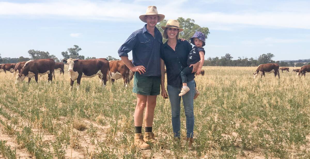 Ben and Jane Reid, with daughter Lani, 2, at their Young property. The Reids are transitioning to rotationally grazing their stock on mixed-species pastures. 