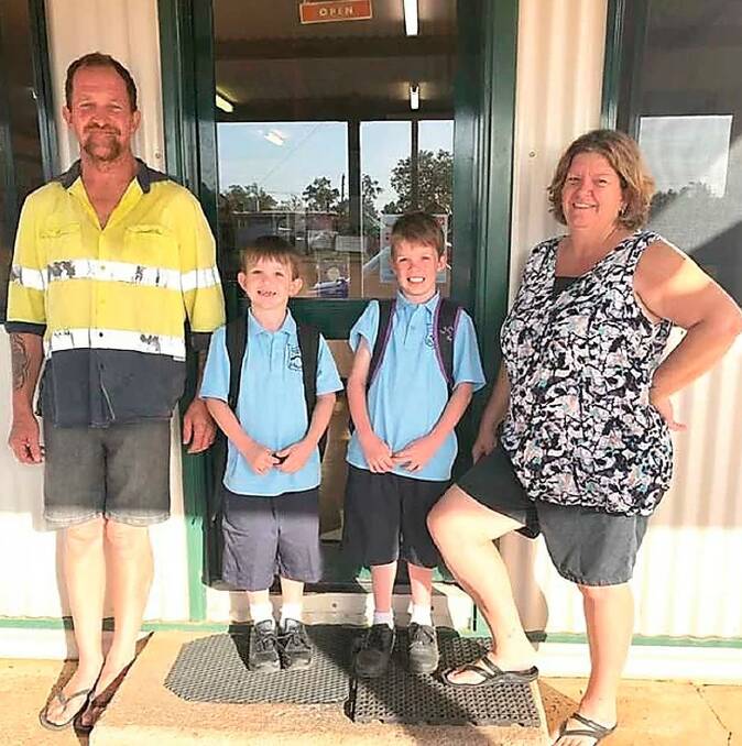 Col and Kathy Brown at the general store with grandsons Lochie and Benji. Photo: Supplied