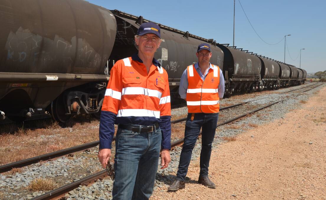 Pacific National CEO Dean Dalla Valle with Pacific National Head of Agriculture Hugh Cox at Junee. The rail freight company has added 60 locomotives to their network this harvest. 