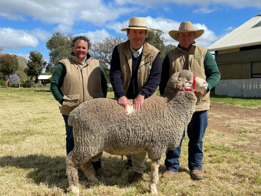 Katrina Lieschke, John Sutherland and Shane Foster of Pooginook with the top-priced ram who sold for $8000 to Craigmore Pastoral Company, Katanning, WA. Photo: Supplied