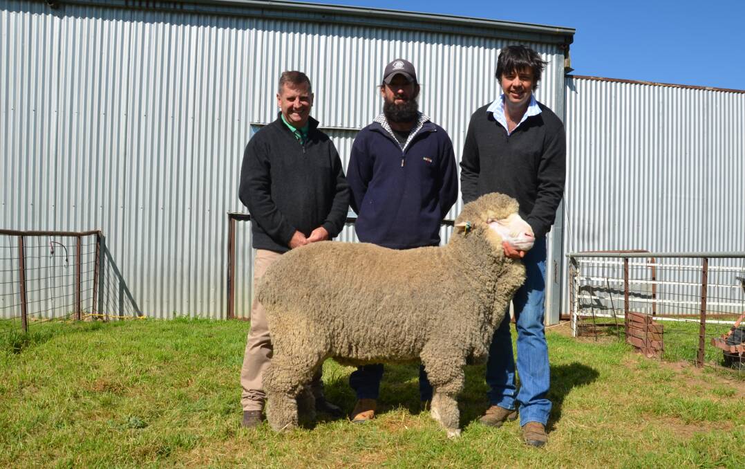 Rick Power, Nutrien, purchaser Ben Johnson, Somersby Pastoral, Boorowa and Koonwarra stud principal Jono Merriman with the top priced ram which sold for $7000. 