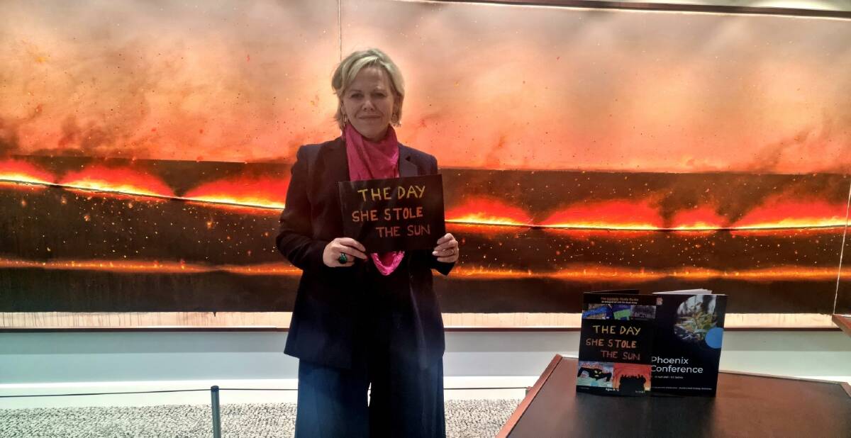 Littlescribe founder Jenny Atkinson with 'The Day She Stole The Sun' written by Cobargo Public School students after the fires. Littlescribe ran workshops for teachers last week to help them tell their stories following the bushfires.