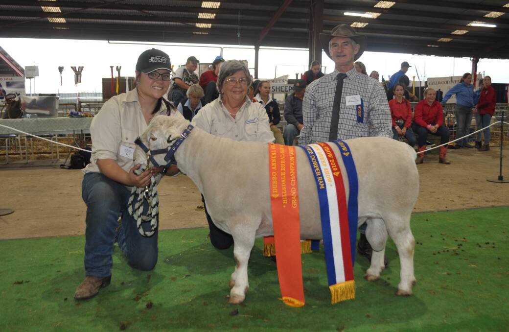 The grand champion ram from Harewood White Dorper Stud, Rocky Forest, Bathurst with Emma Jackson, Diana Stewart, Harewood and judge, Graeme Budd, Old Munbilla, Coutts Crossing via Grafton. 